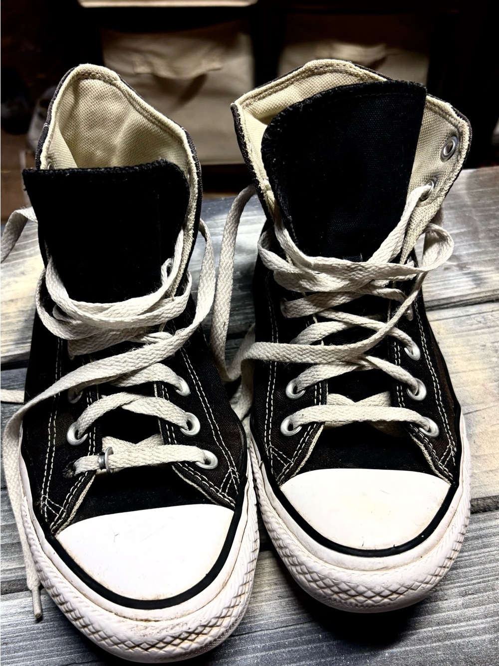 Black Converse sneakers with white rubber toe cap and sole, size womens 8.5